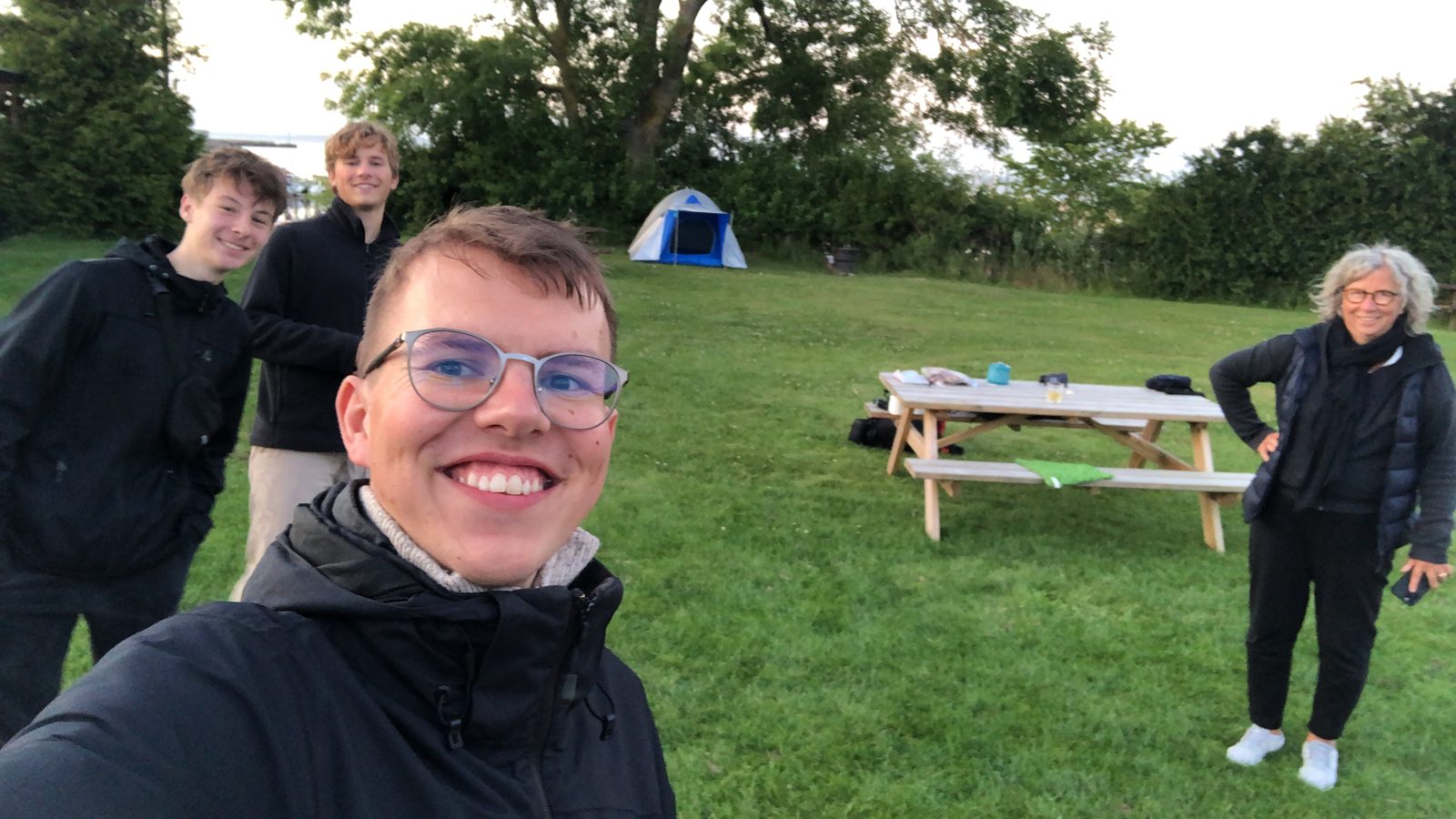 Smiling selfie at a campsite in Fynshav